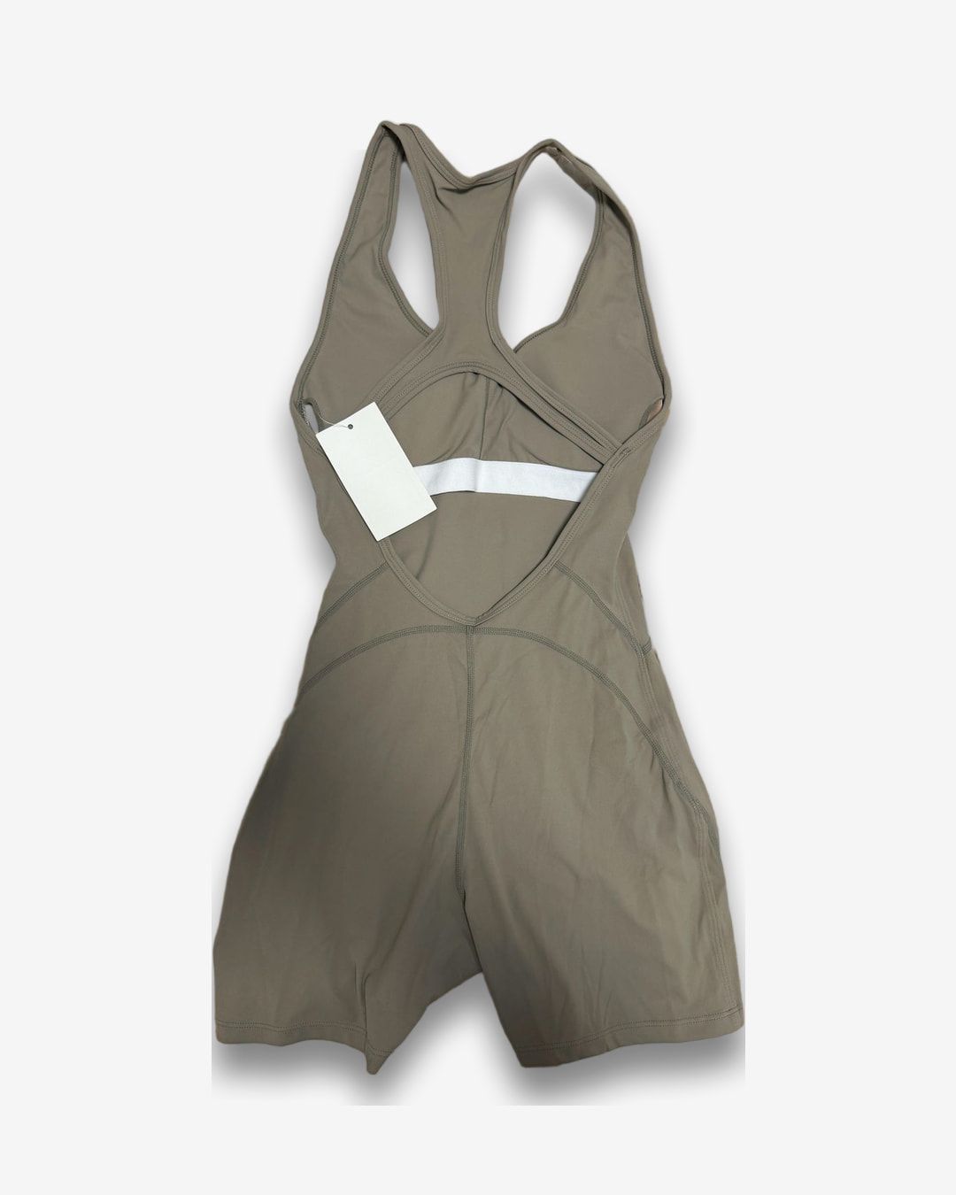 אוברול ספורטיבי לנשים בצבע בז' חדש עם תווית