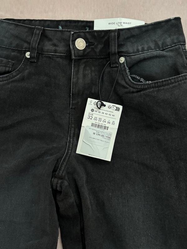 ג'ינס שחור לנשים בגזרת wide low waist עם מותן נמוך חדש עם תווית
